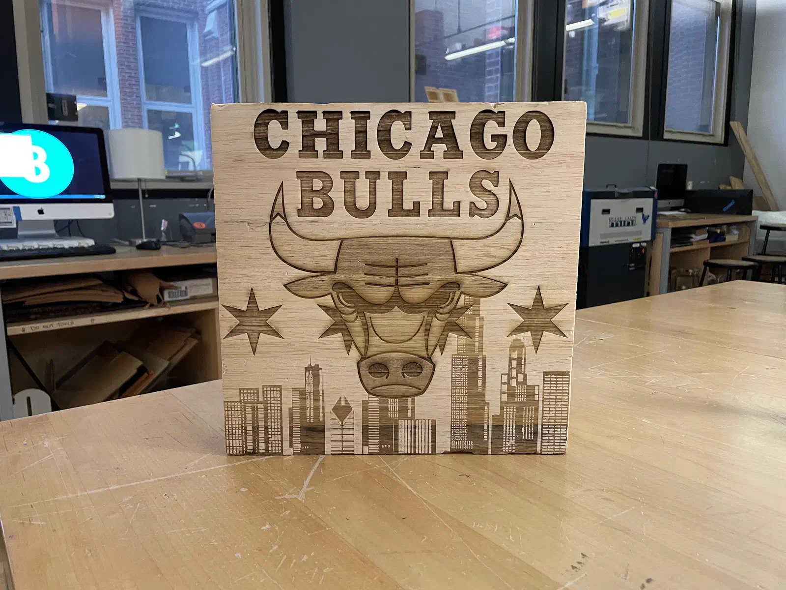 A Chicago Bulls plaque with the team logo carved above a skyline and stars.