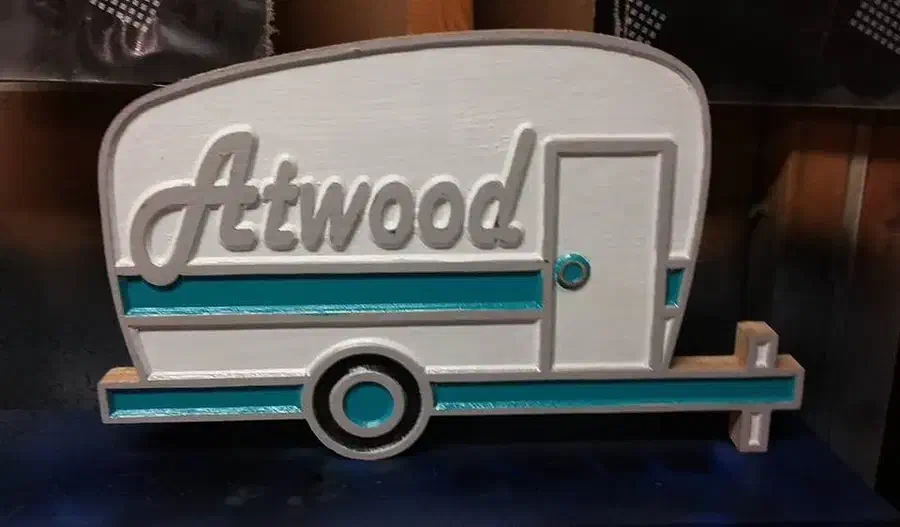 Finished white and turquoise wood camper sign personalized with the name Atwood