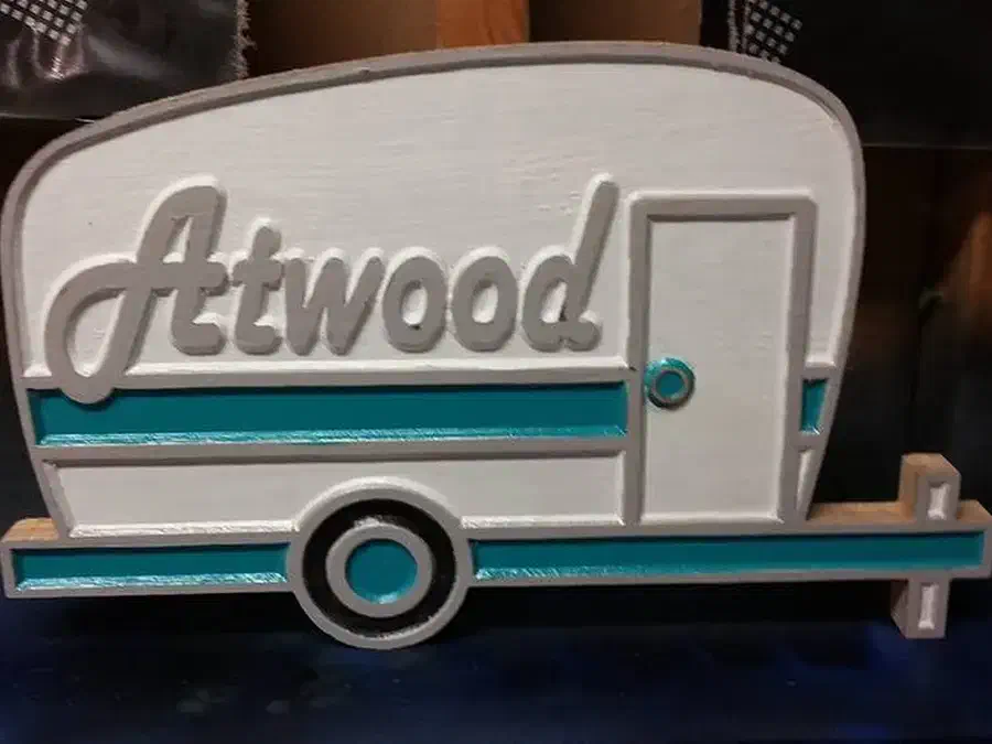 Finished white and turquoise wood camper sign personalized with the name Atwood