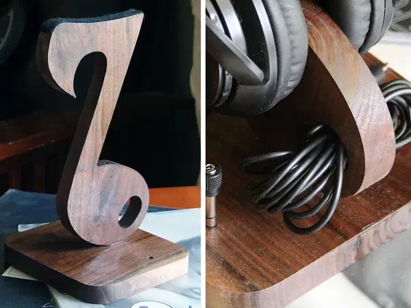 Two original maker photographs side by side: the complete walnut music-note stand on the left, and its base holding a coiled headphone cord and plug adapter on the right