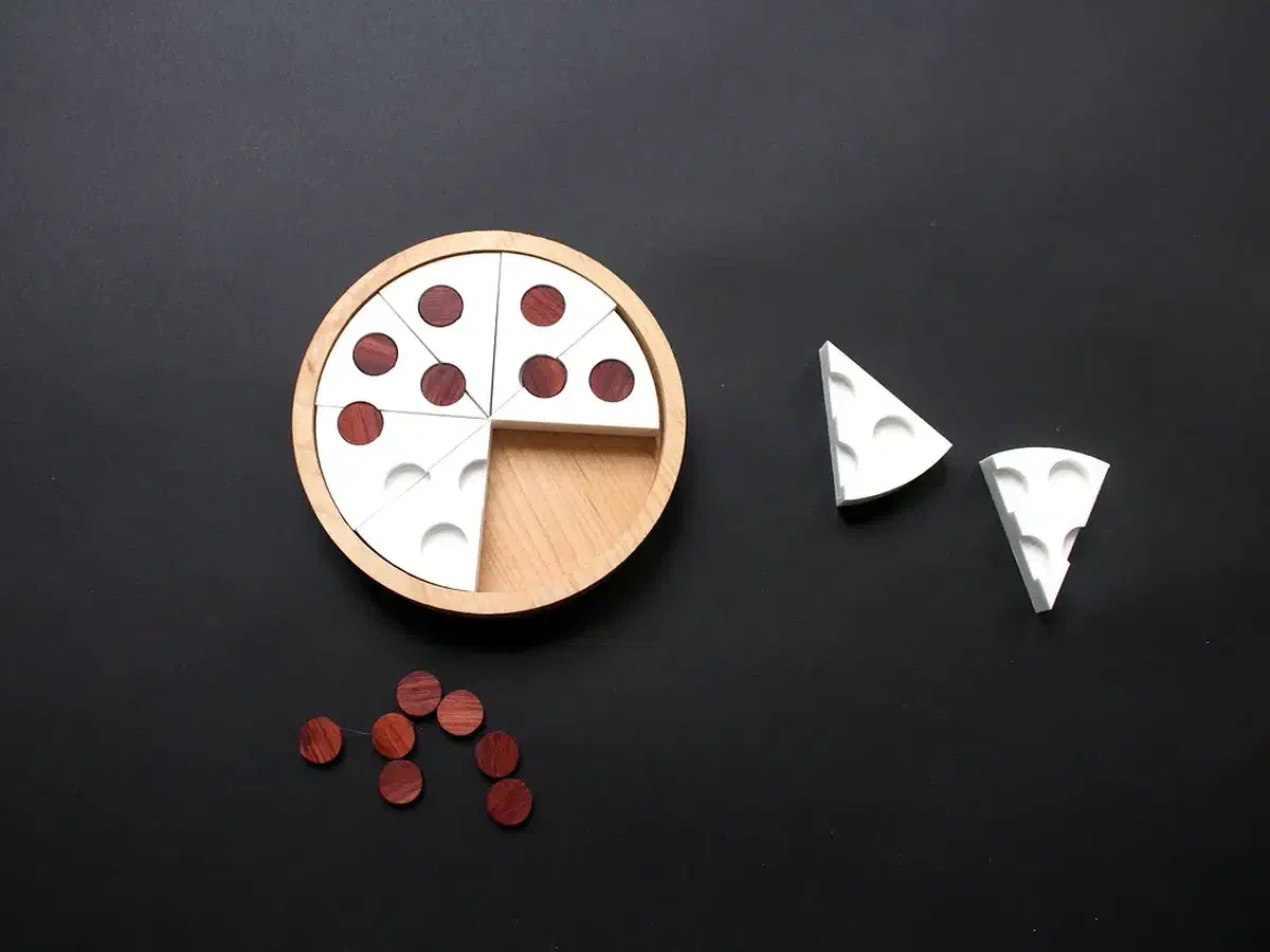 Wooden pizza-slice puzzle assembled in a round tray with contrasting round topping pieces