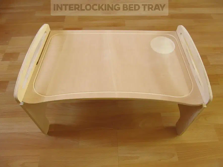 A plywood bed tray with interlocking legs and raised sides